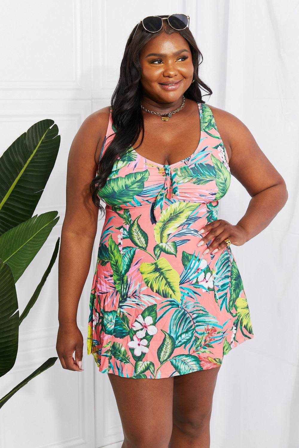 Marina West Swim Full Size Sail With Me V-Neck Swim Dress in Coral, floral print, thick straps, and plunge neckline.