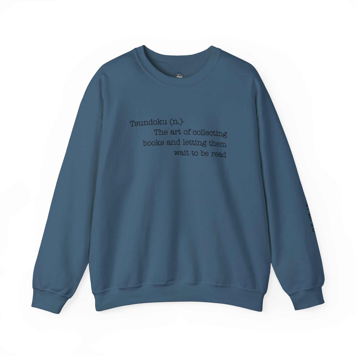 "T. B. R. Tsundoku" crewneck sweatshirt with book collecting definition on front and T.B.R. bold initials on sleeve.