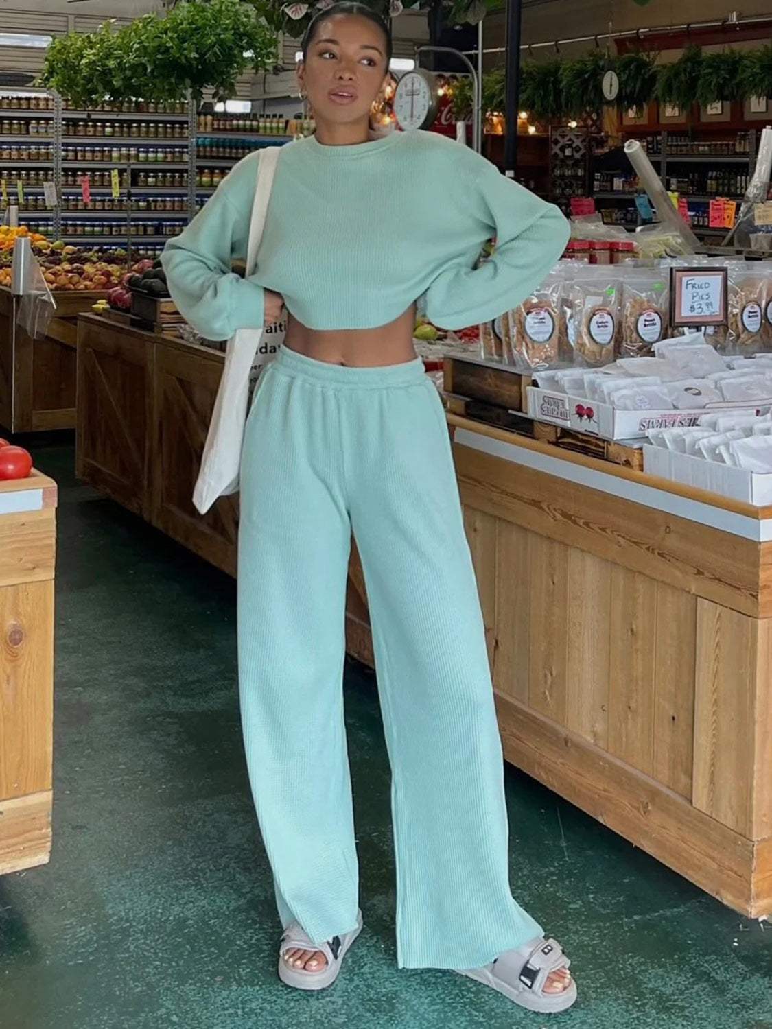 Waffle-knit round neck top and pants set in mint green displayed in a marketplace setting.