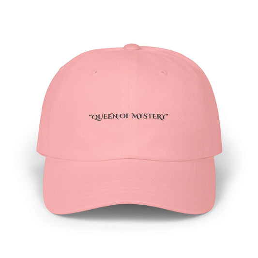 Classic dad cap in pink with "Queen of Mystery" text, featuring a 6-panel structure and precurved visor.