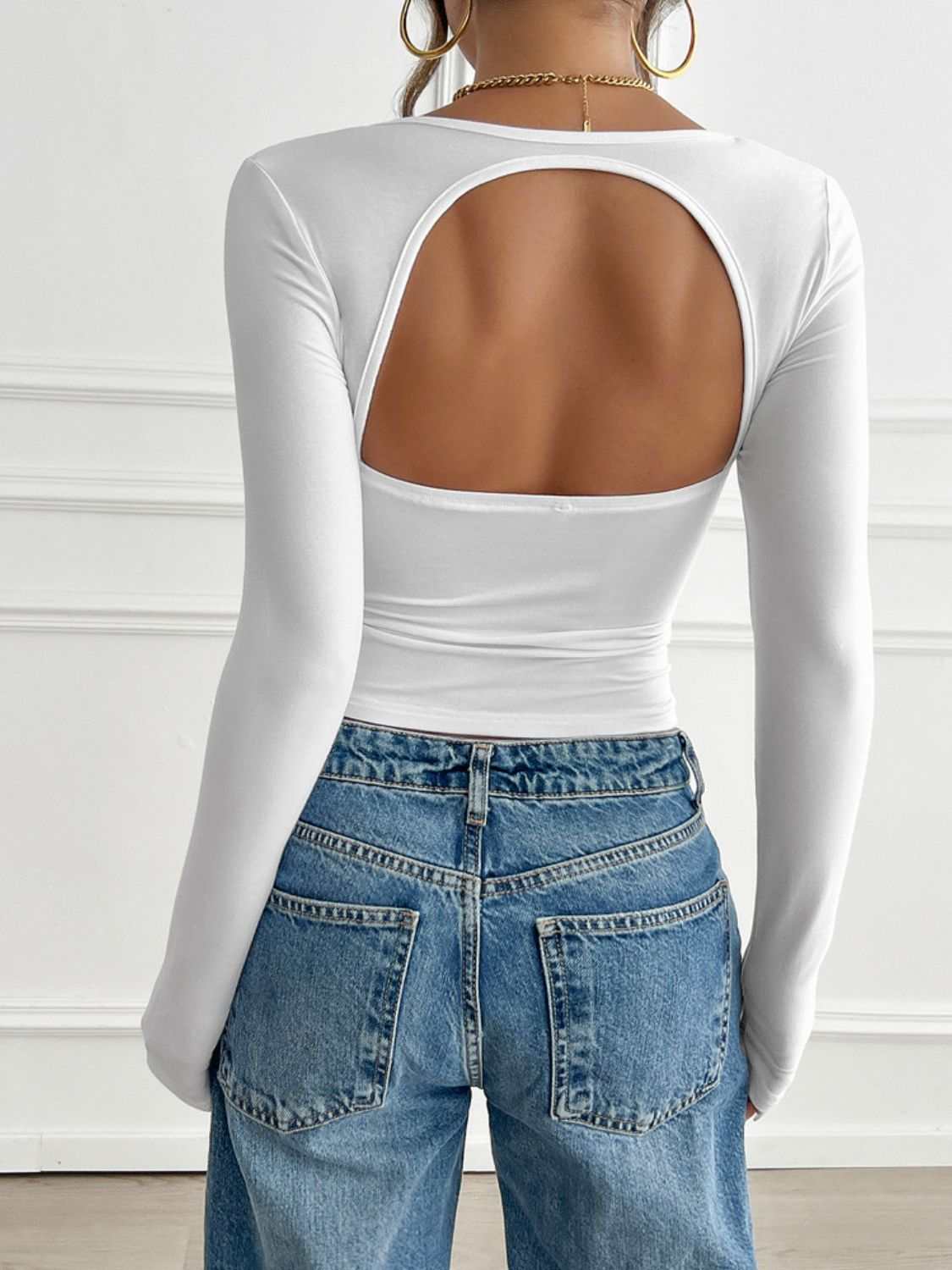 Devine Cutout Square Neck Long Sleeve T-Shirt in white, back view, paired with jeans.