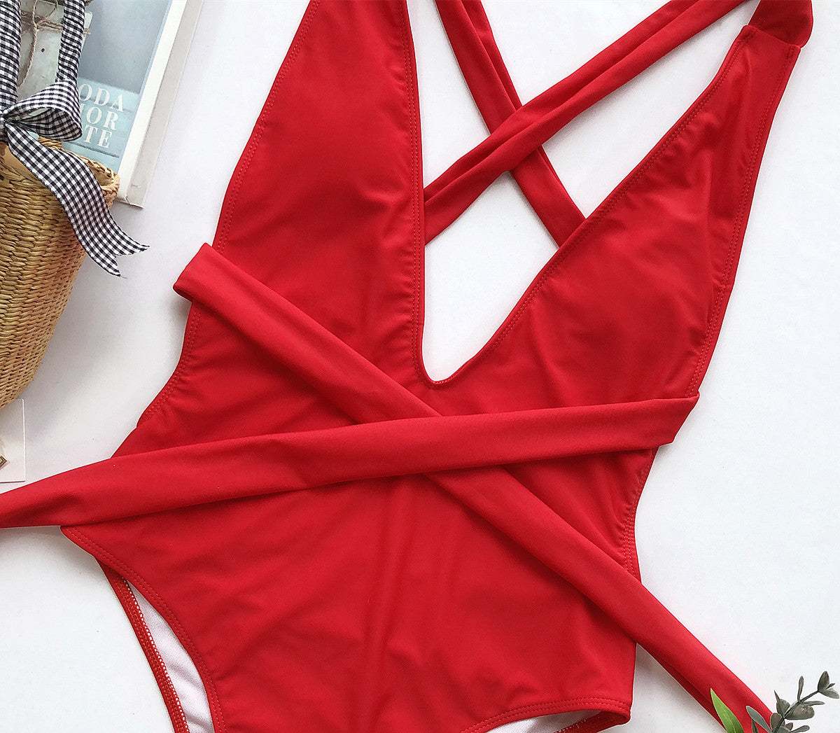 Halter Neck Deep V Tied One-Piece Swimsuit in red with crisscross design and adjustable ties.