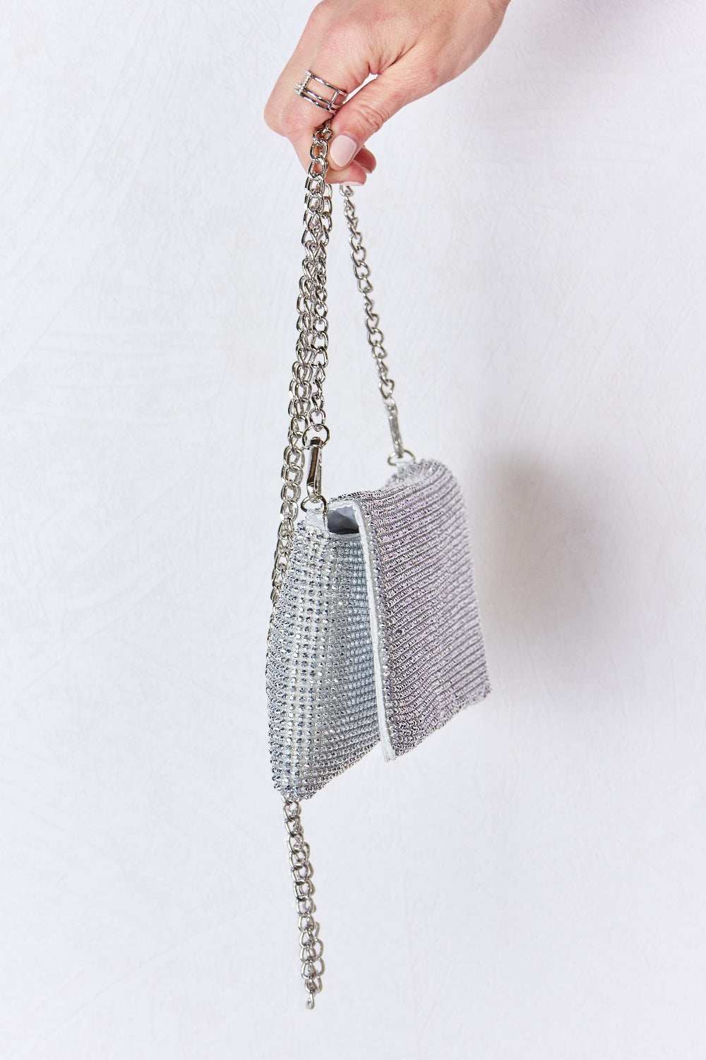 Forever Link Rhinestone Crossbody Bag with sparkling embellishments and chain strap.