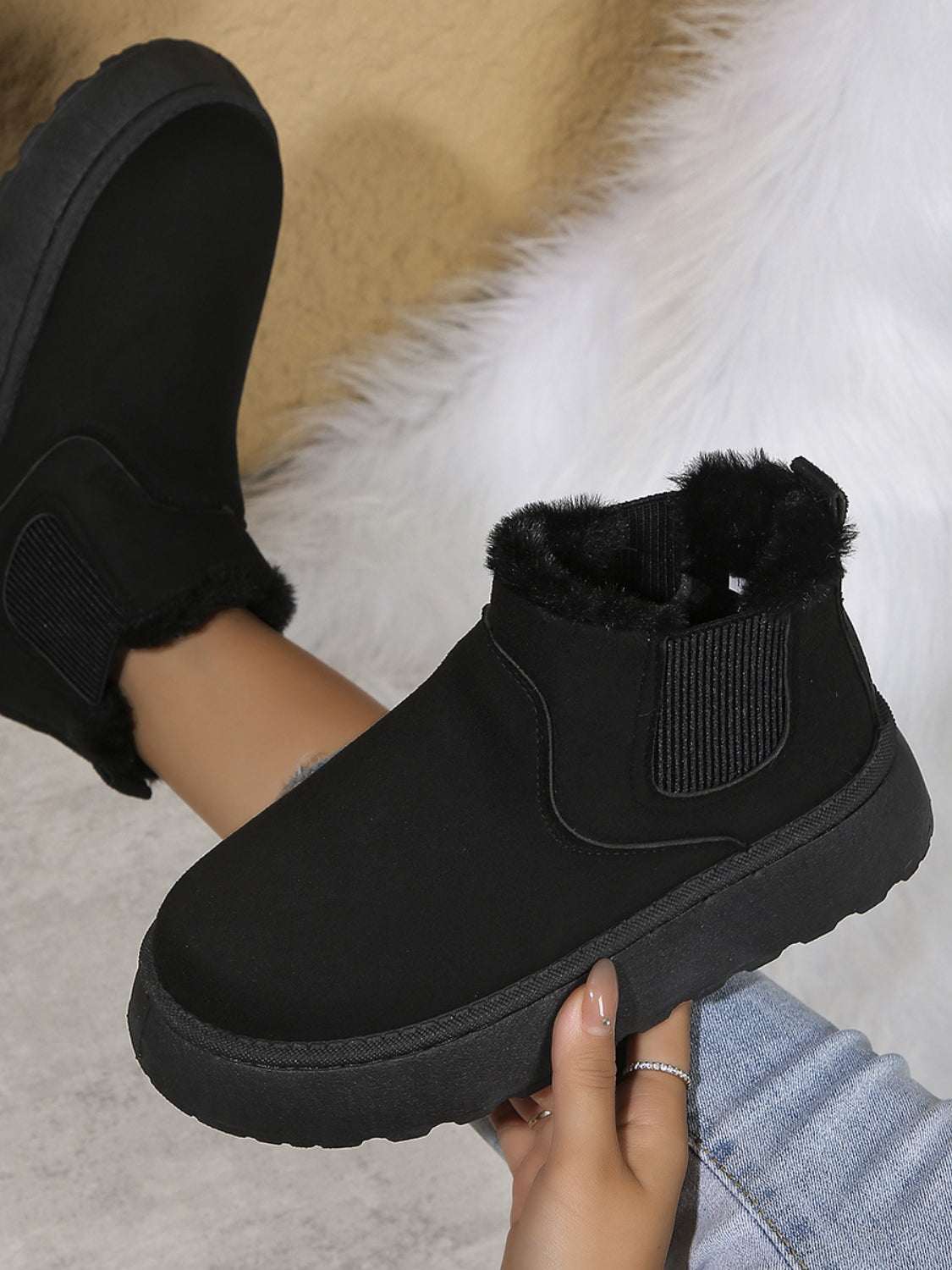 Suede round toe platform boots with faux fur lining.