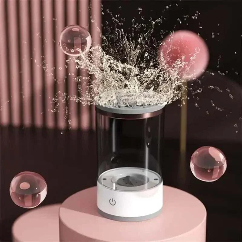 Electric makeup brush cleaner with water splash effect, handheld design for deep cleaning.