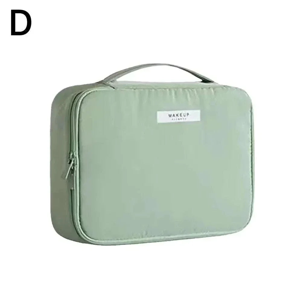 Waterproof green portable cosmetic bag with high capacity for toiletries and makeup storage.