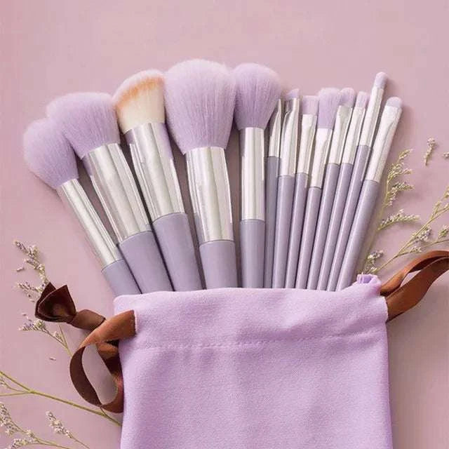 13-piece professional makeup brush set with lilac handles, featuring super soft wool fiber bristles for blush, foundation, concealer, and more. Ideal for travel and everyday beauty routines.