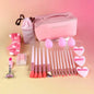 27-piece makeup tool set with cosmetic bag, brushes, and powder puffs for travel and daily use.