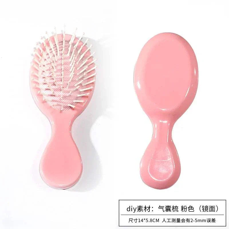 Portable pink comb mirror with DIY simulation cream glue material for girls' makeup.