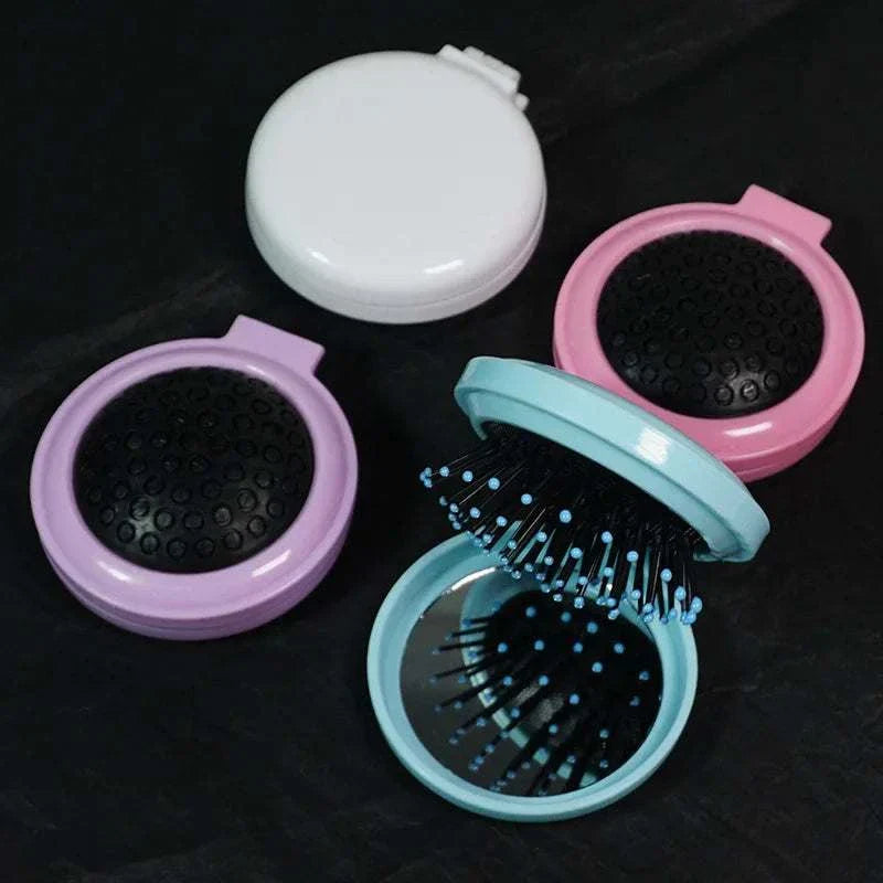 Portable airbag small comb mirror with colorful design for girls' makeup materials.