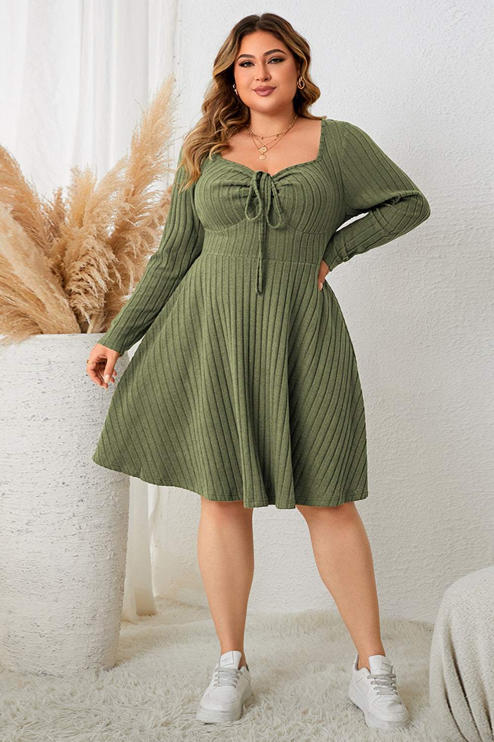 Plus size sweetheart neck long sleeve ribbed dress in green.