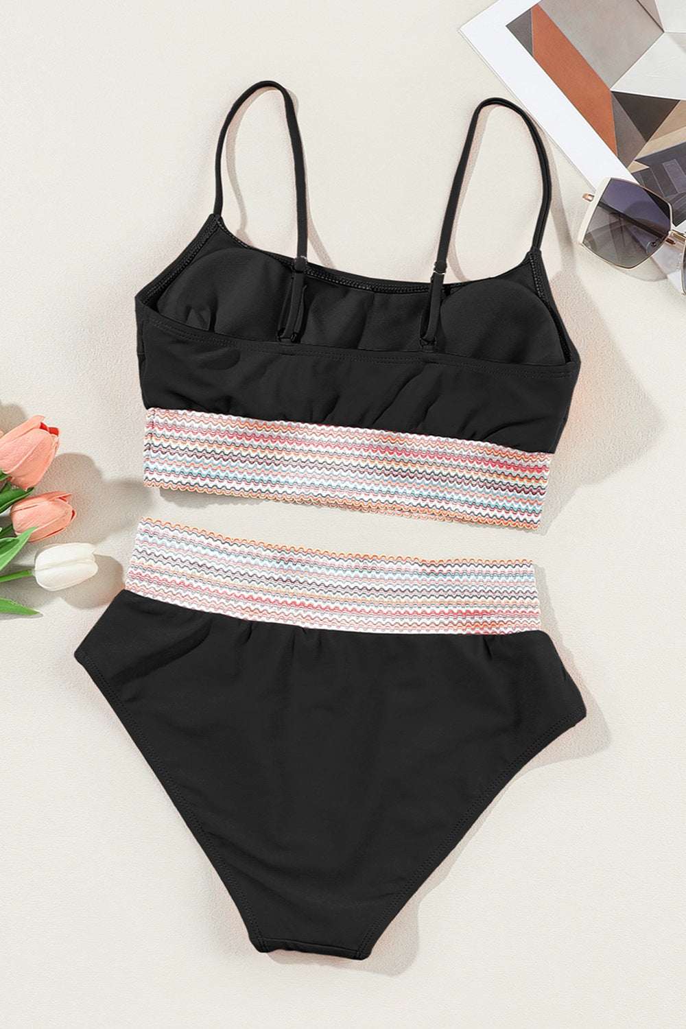 Scoop neck spaghetti strap two-piece swim set with removable padding and stretchy fabric.