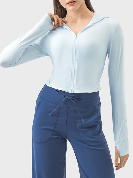 Light blue hooded long sleeve active outerwear for women.