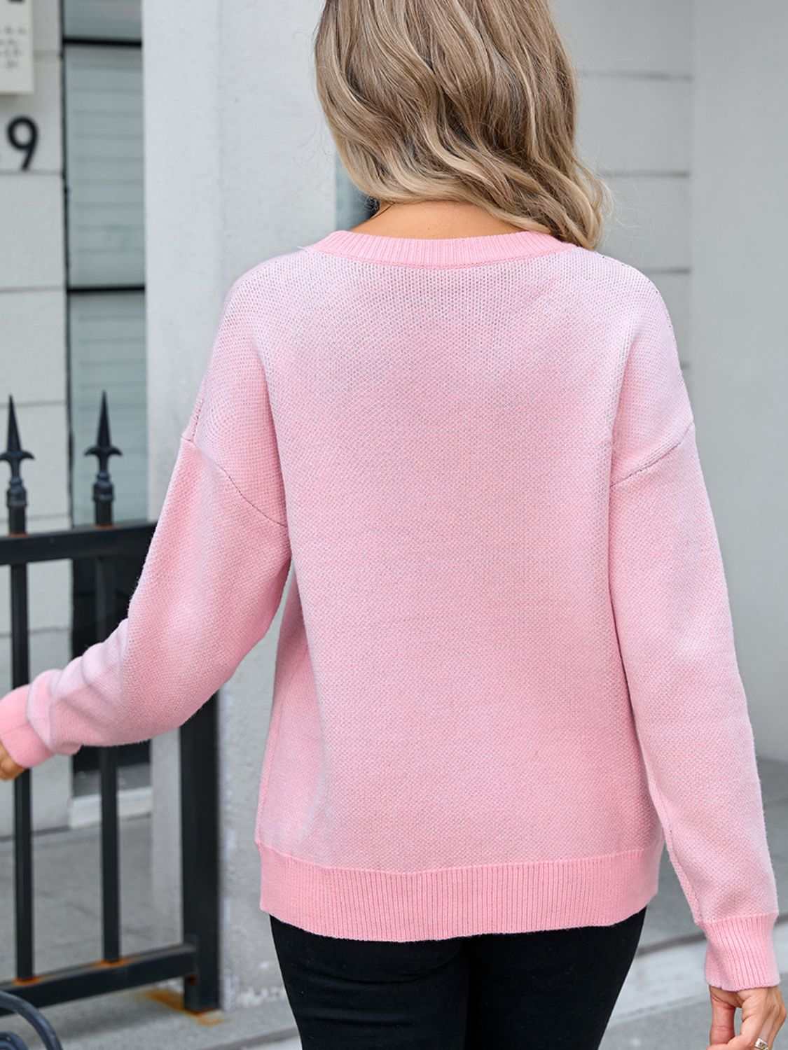 Back view of a pink Angel Wings Bow Round Neck Dropped Shoulder Sweater with moderate stretch.