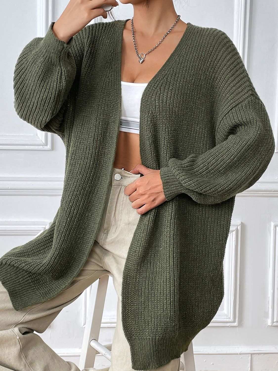 Open front long sleeve cardigan in olive with moderate stretch, 100% polyester.