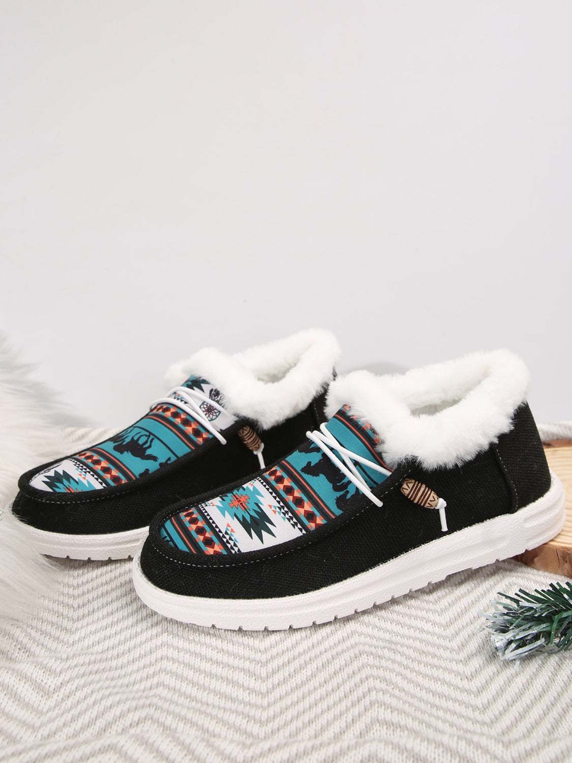 Printed round toe flat slip-ons with faux fur lining and colorful pattern, ideal for casual wear.