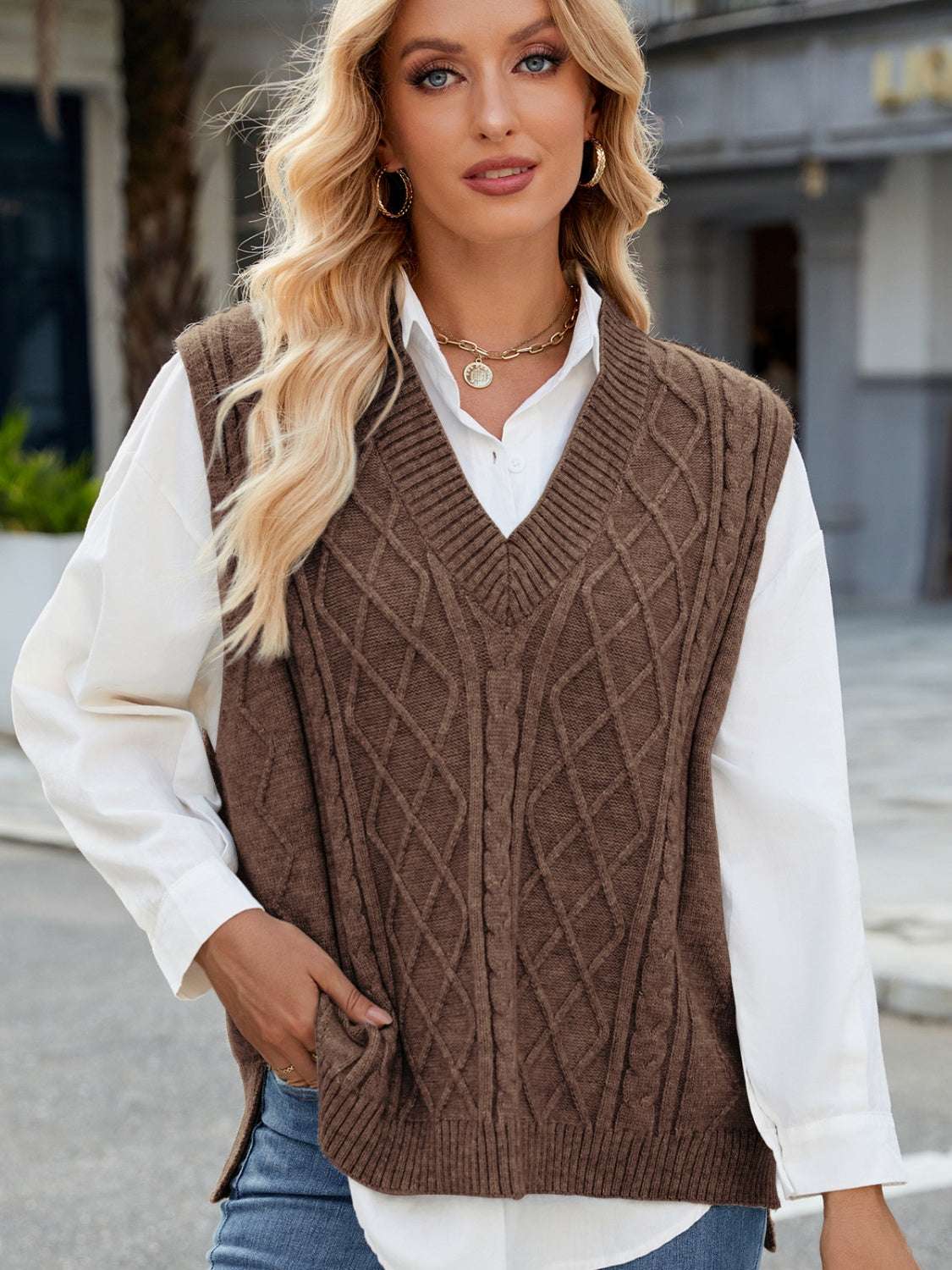 Cable knit V-neck sweater vest in brown, made from 100% acrylic.