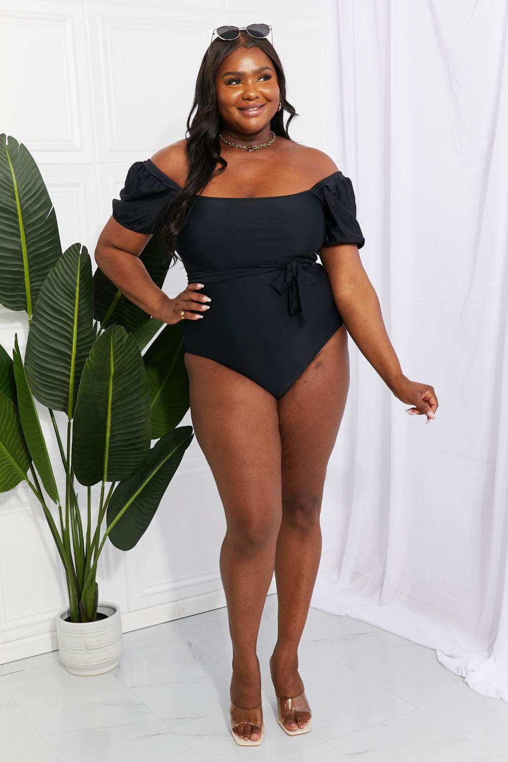 Marina West Swim Salty Air puff sleeve black one-piece swimsuit with square neck and tie belt.