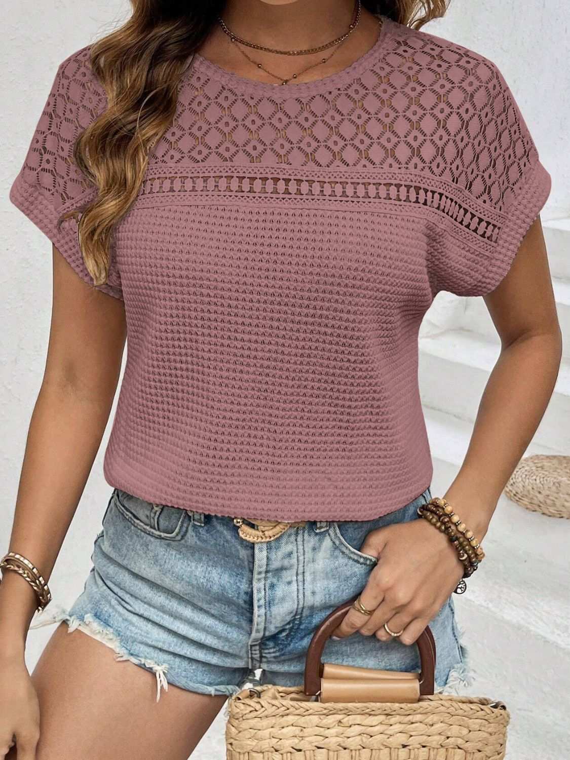 Waffle-knit round neck short sleeve top with lace detail in mauve.