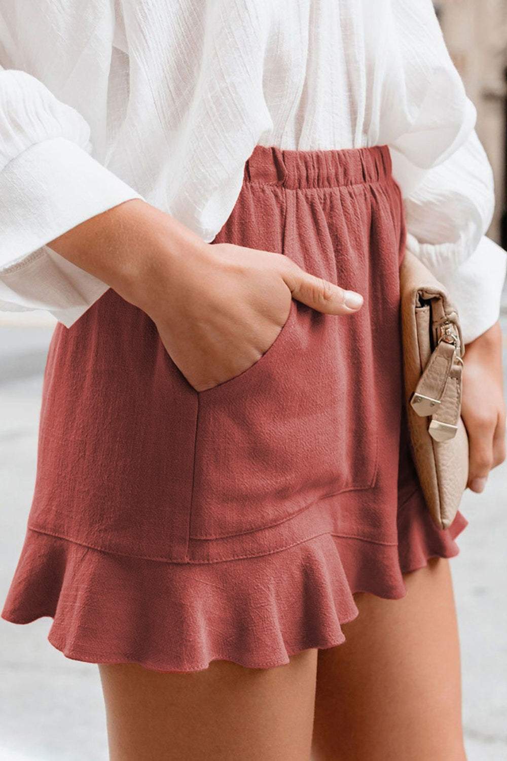 Full size ruffled elastic waist shorts in red with side pocket detail.