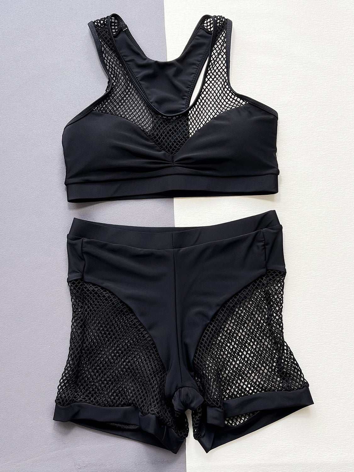 Openwork sleeveless top and shorts swim set, black two-piece with mesh details, 100% polyester.