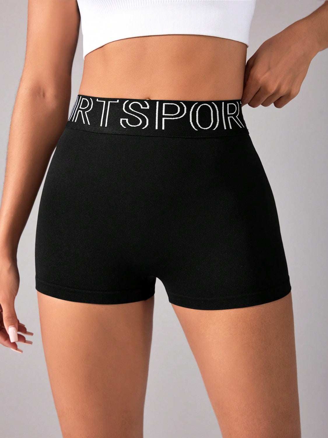 High waist black active shorts with moderate stretch.