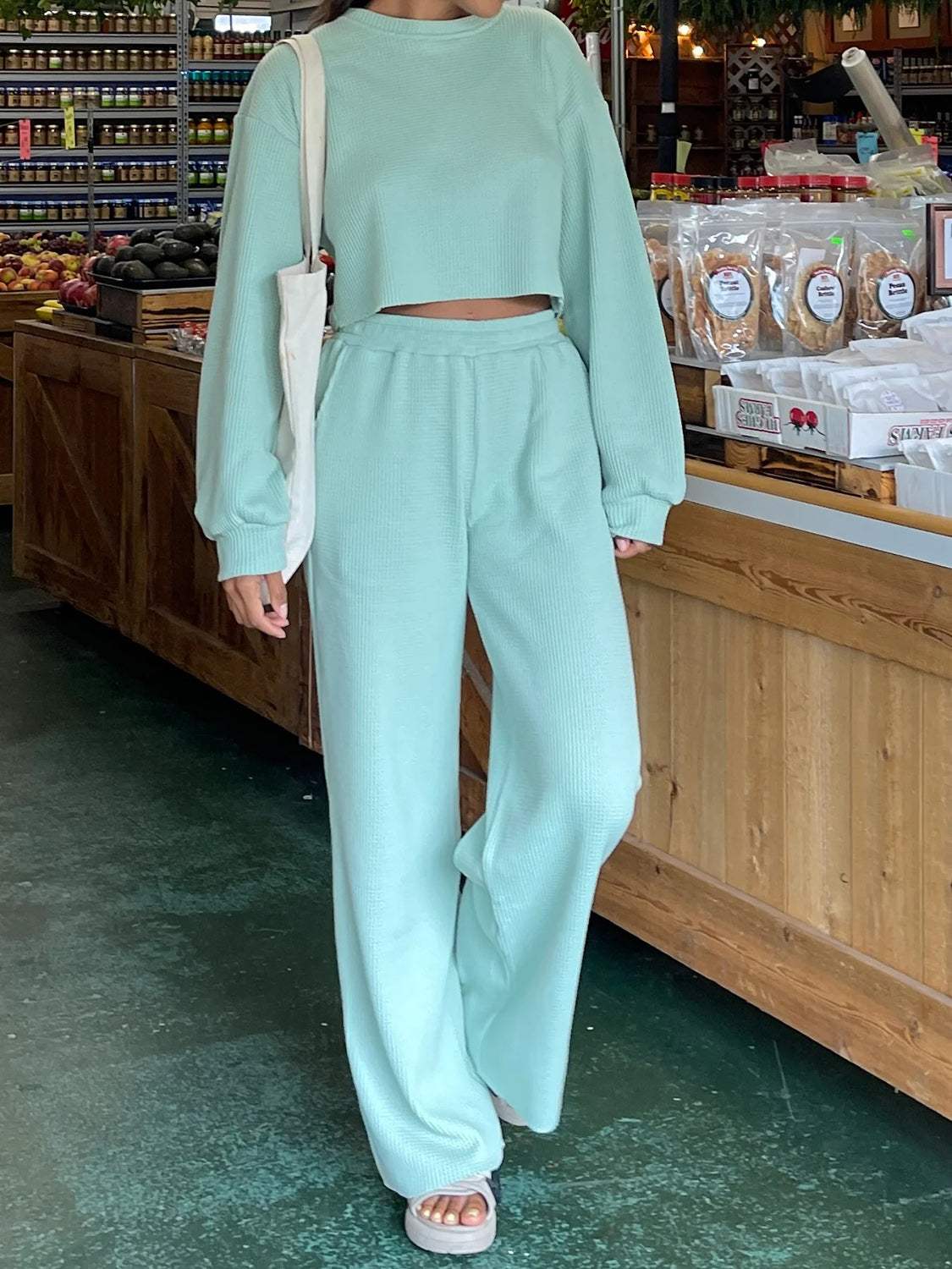 Waffle-knit round neck top and pants set in light blue, casual style, slightly stretchy.