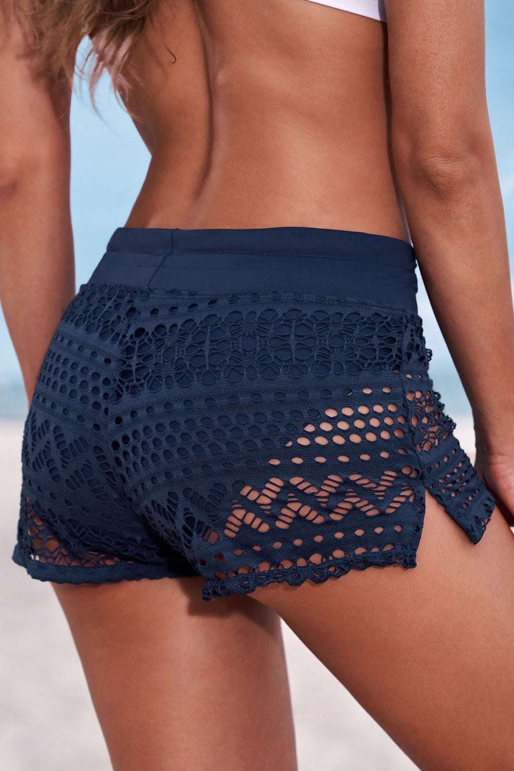 Full size drawstring waist swim shorts with openwork lace design, solid pattern, beach style.