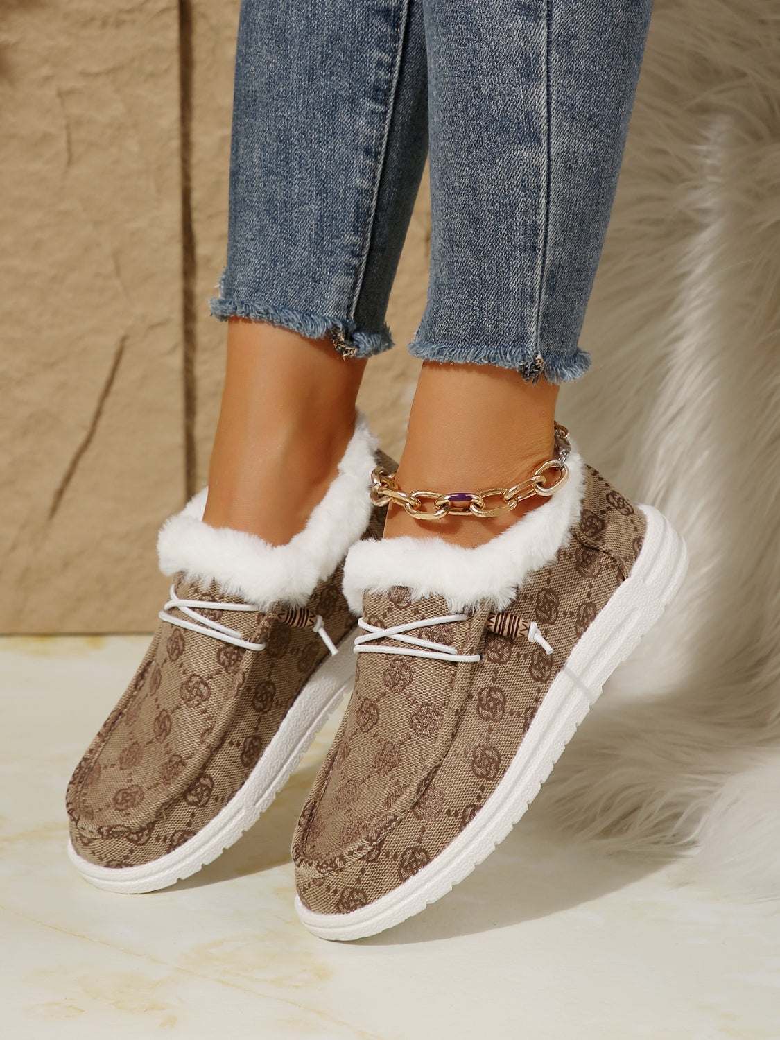 Printed round toe flat slip-ons in faux fur and cotton, featuring a patterned design and flat heel.