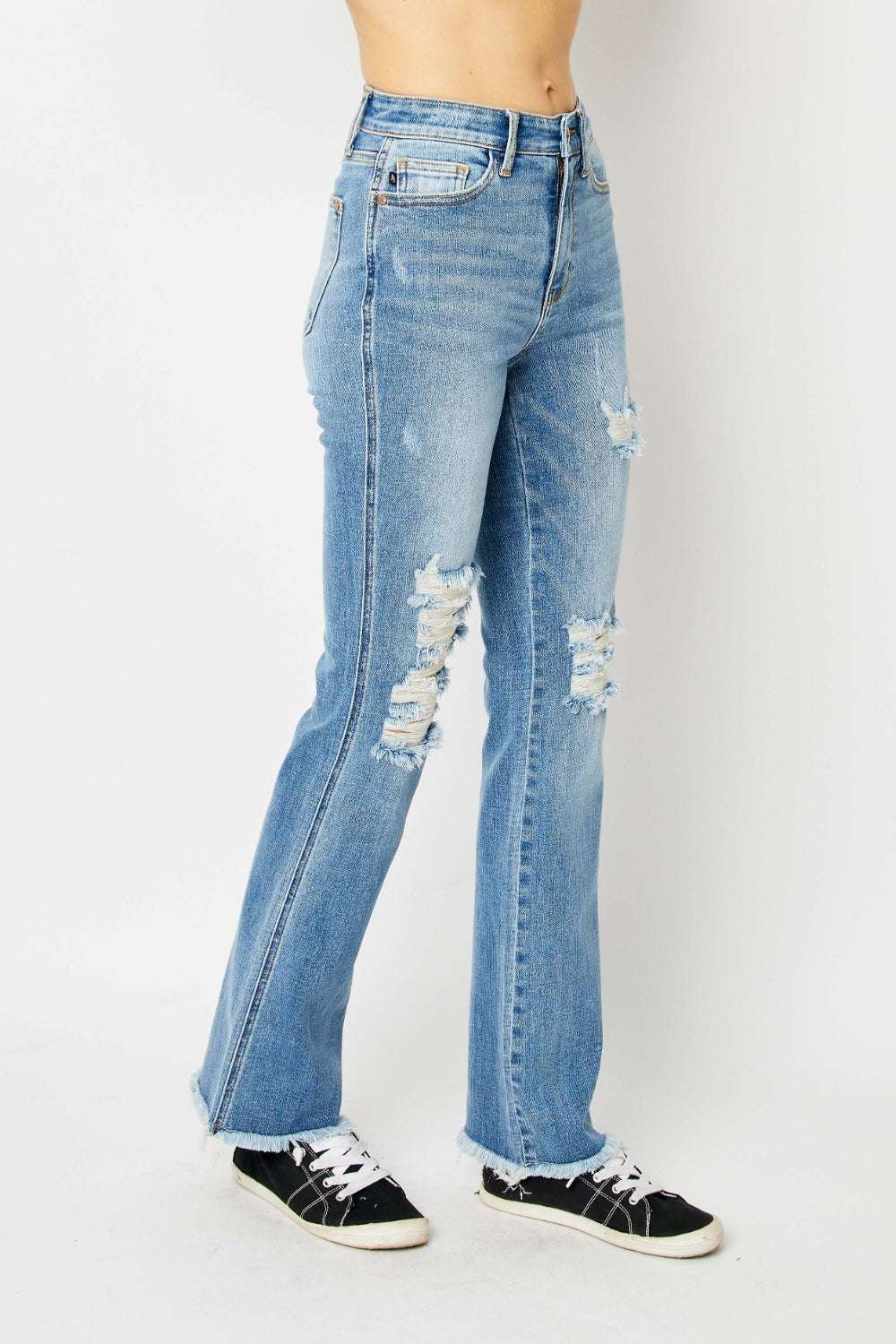 Judy Blue Full Size Distressed Raw Hem Bootcut Jeans with edgy distressing and casual flair.