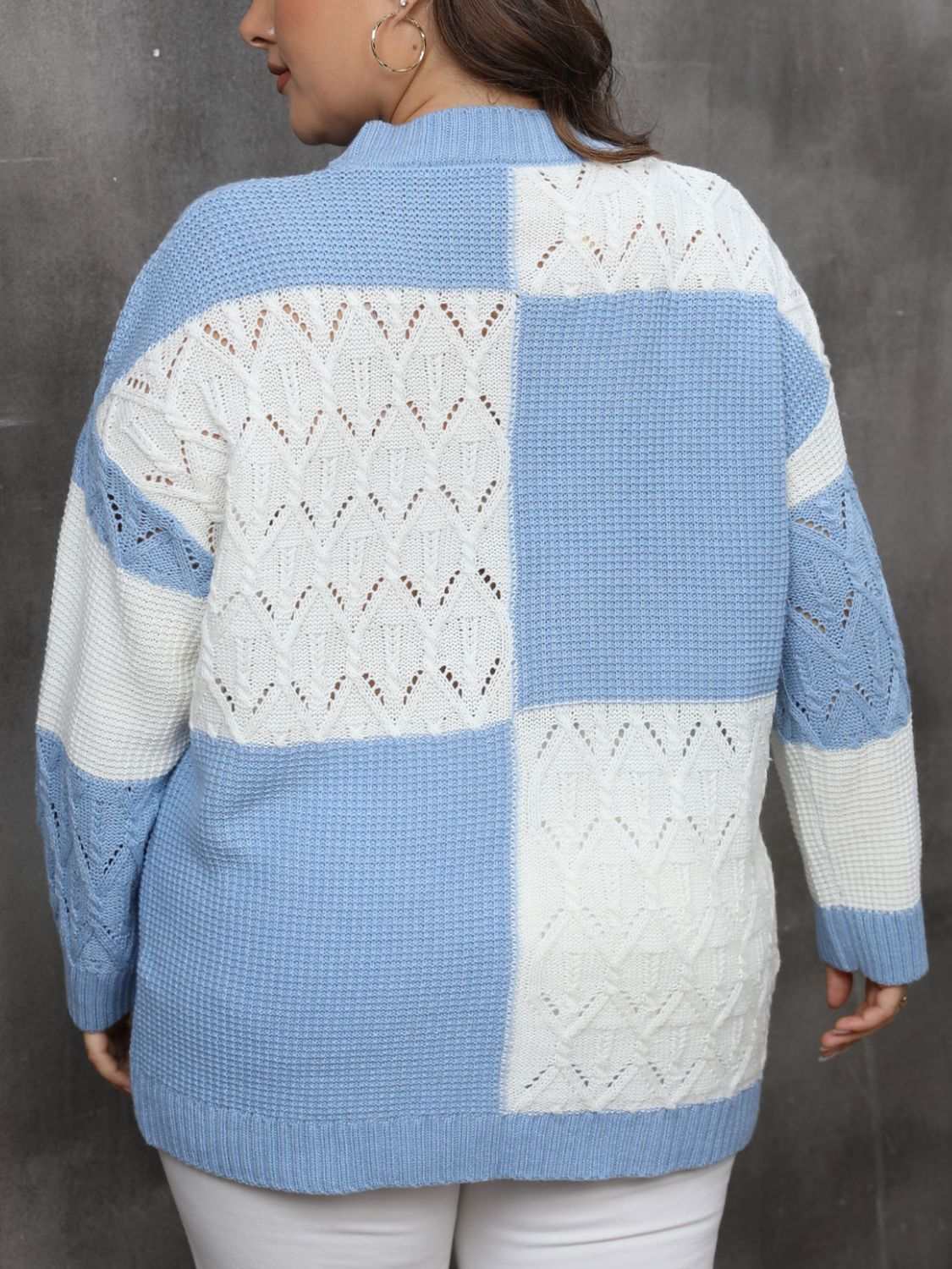 Plus size openwork color block long sleeve sweater in blue and white.