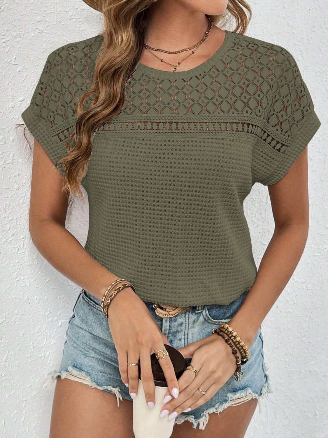 Waffle-knit round neck short sleeve top with lace detail, semi-sheer fabric in olive green.