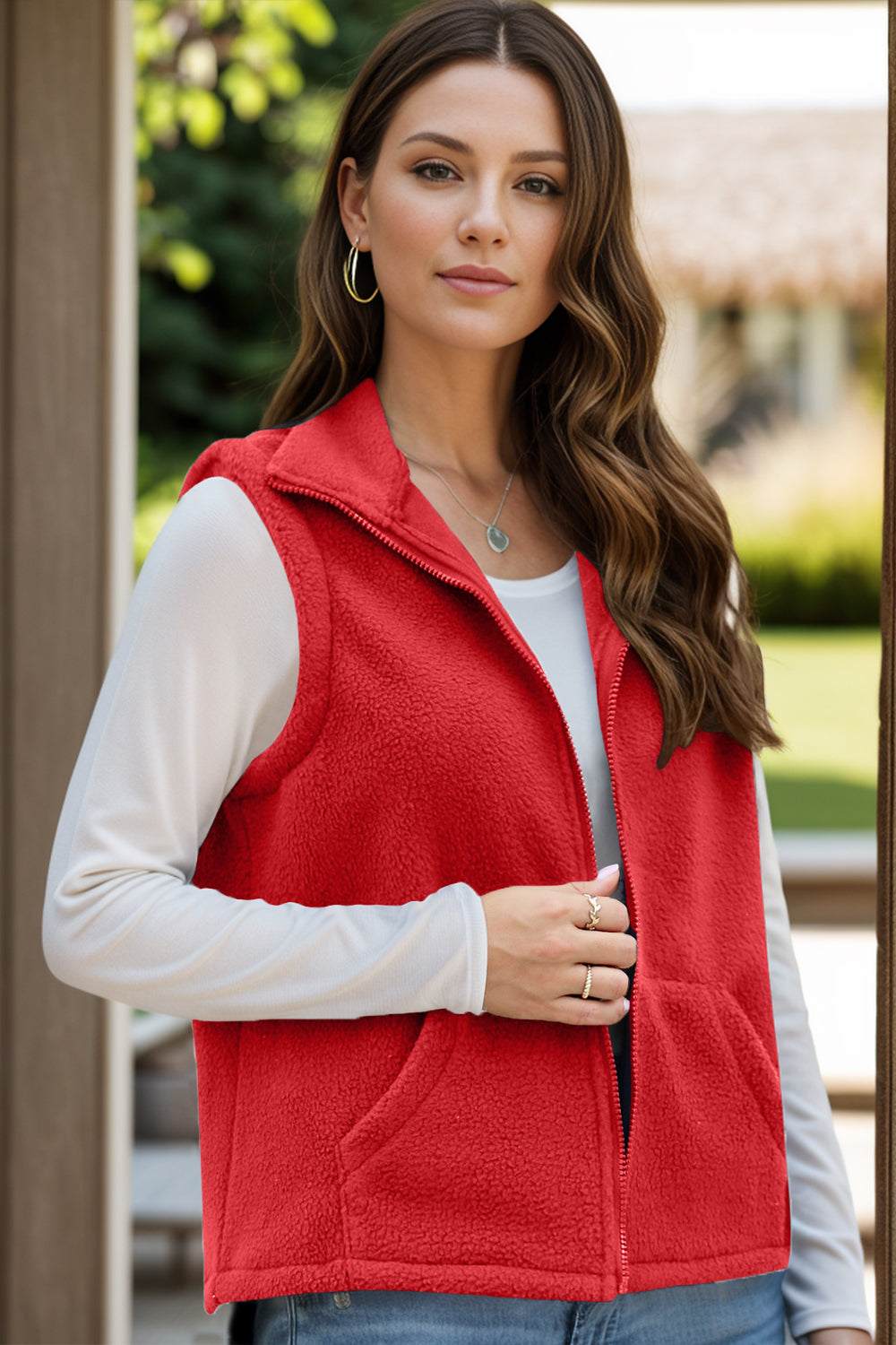 Red zip-up vest coat with pockets for women.