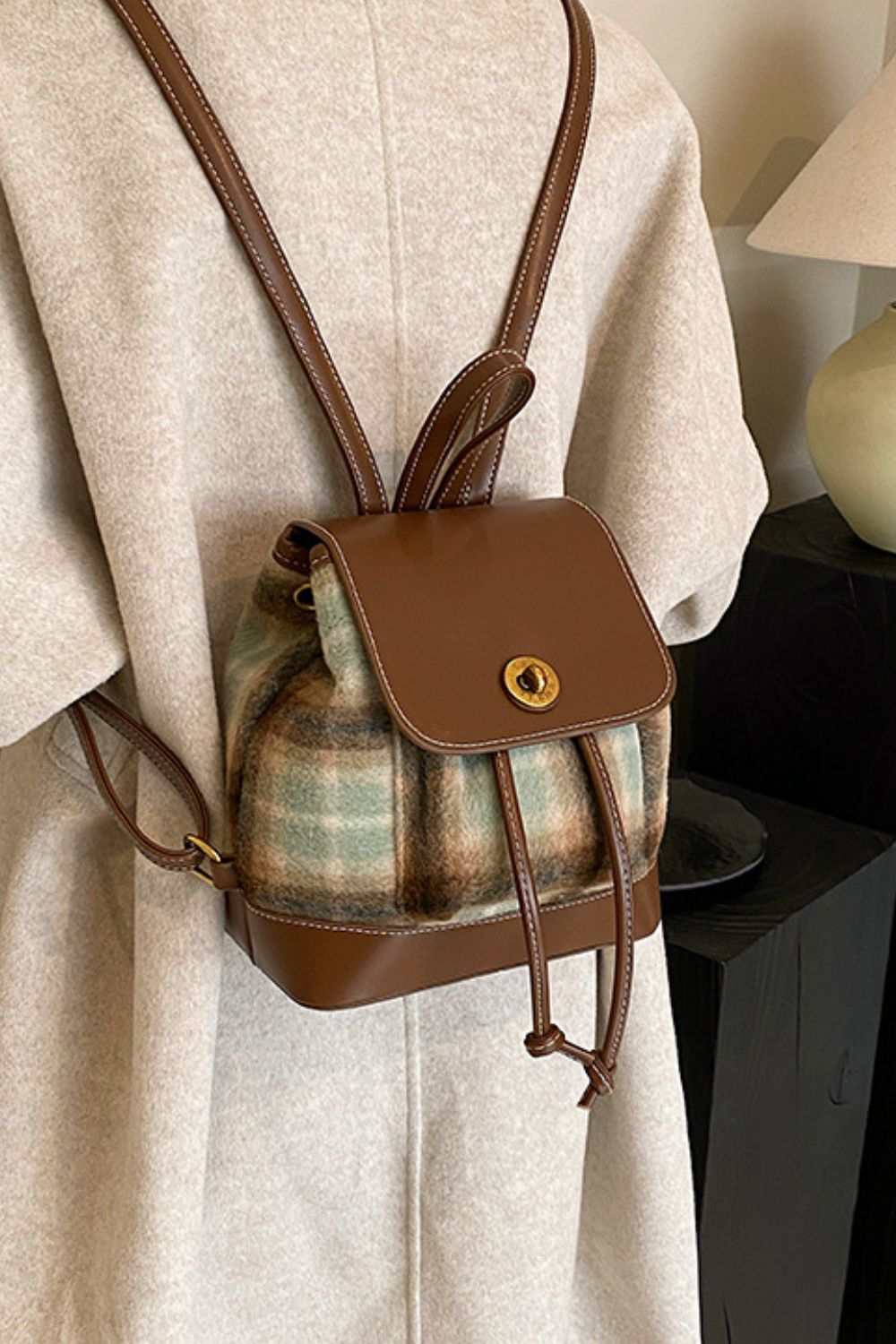 Small PU leather drawstring plaid backpack bag with brown accents.