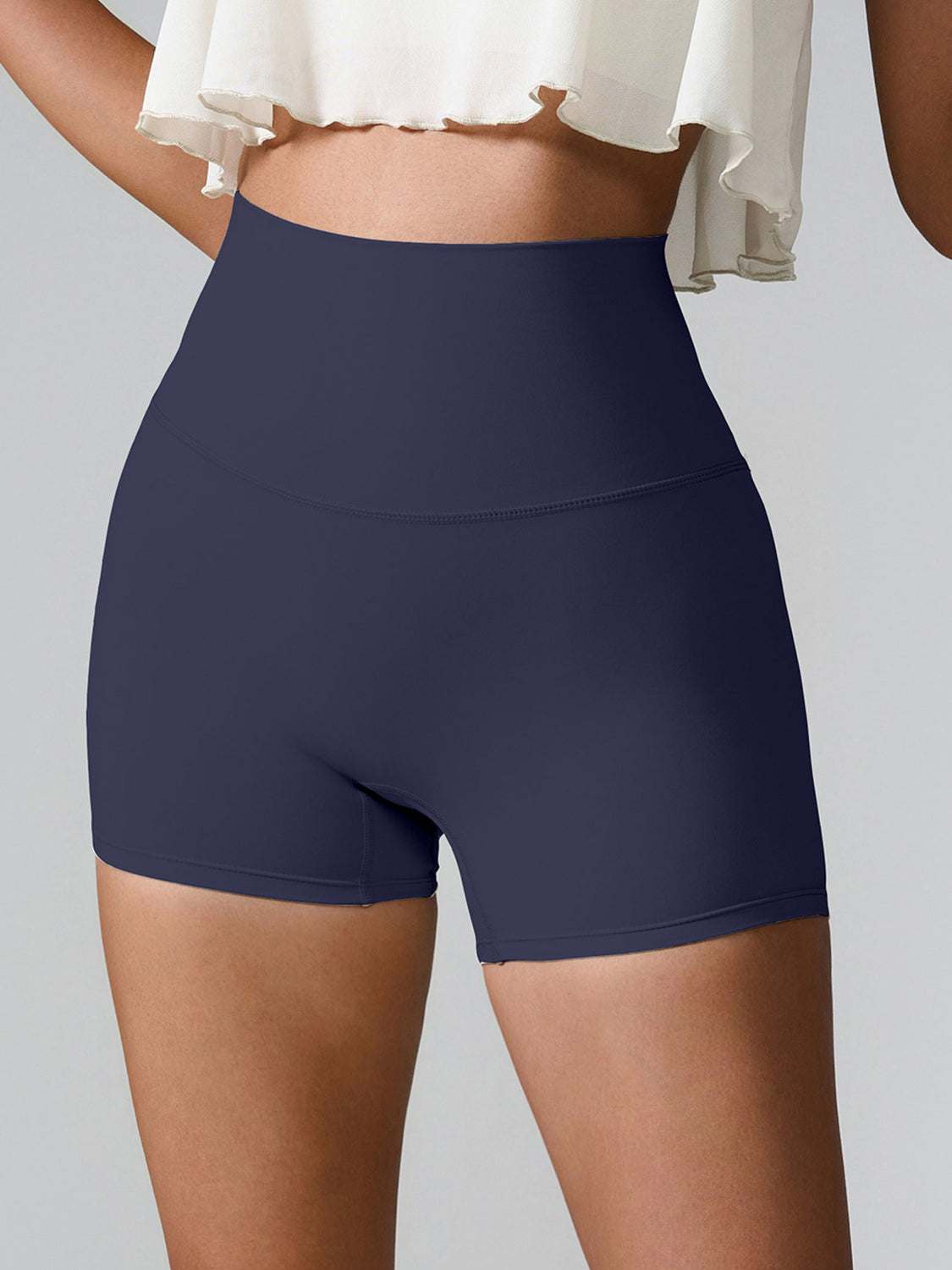 High Waist Active Shorts with pockets, highly stretchy nylon-spandex blend, shown in navy.