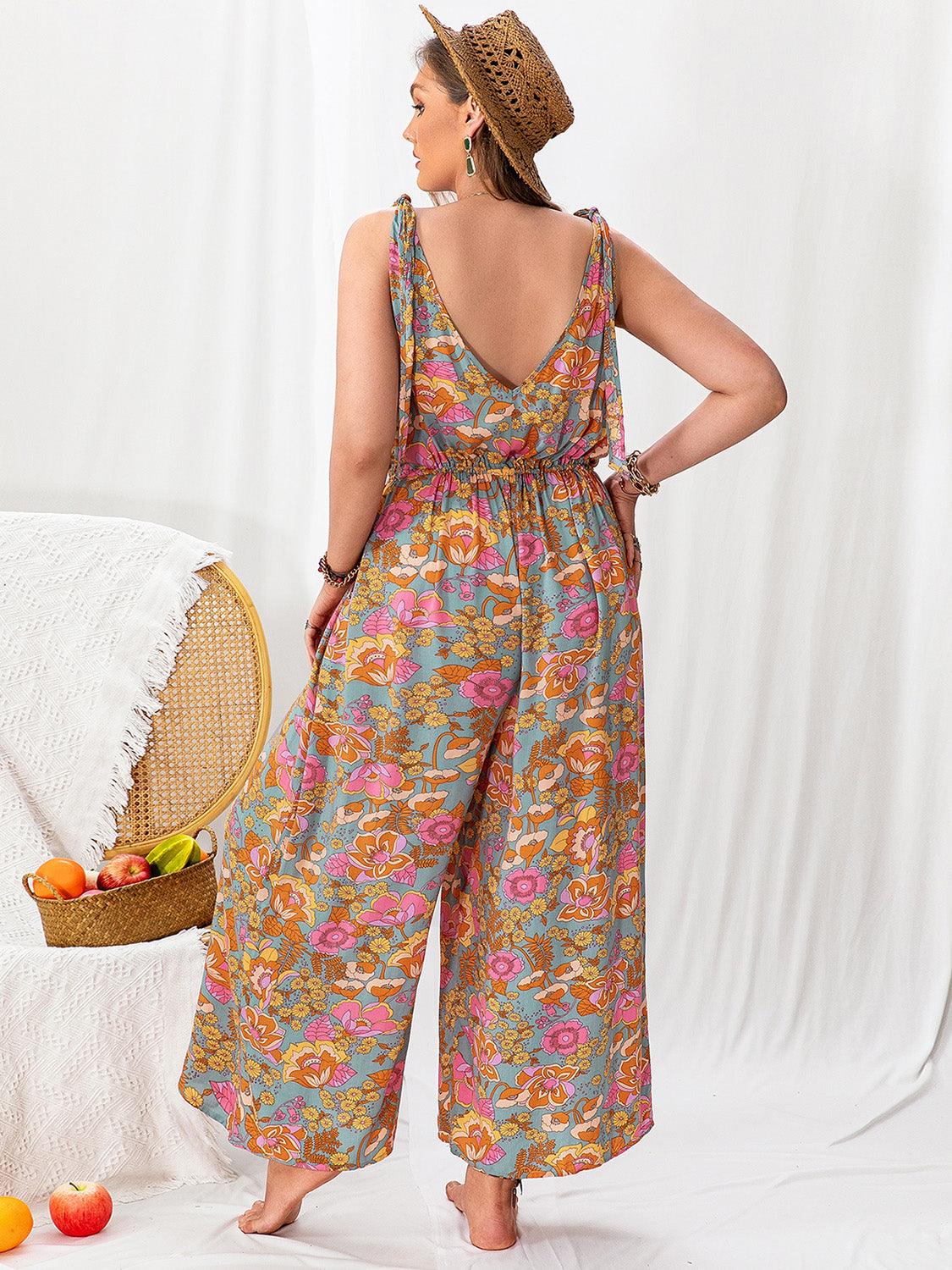 Plus size printed wide leg sleeveless jumpsuit, tied backless design, 100% viscose.