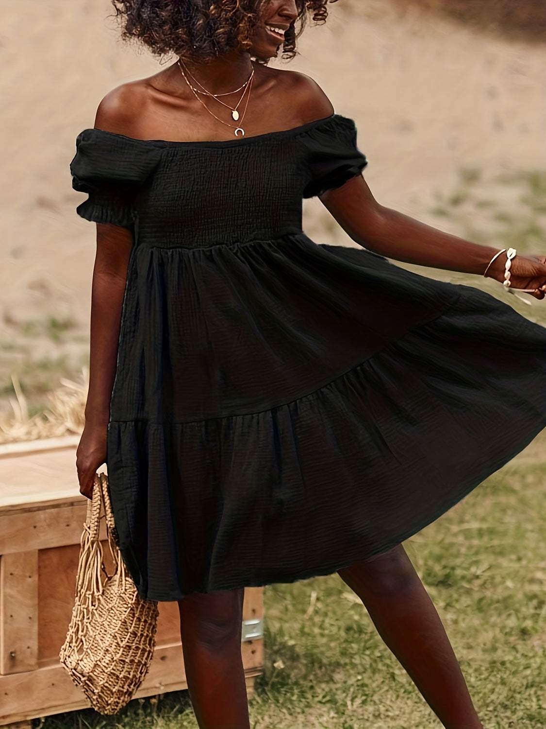 Full size ruffled off-shoulder short sleeve dress in black with ruched design.