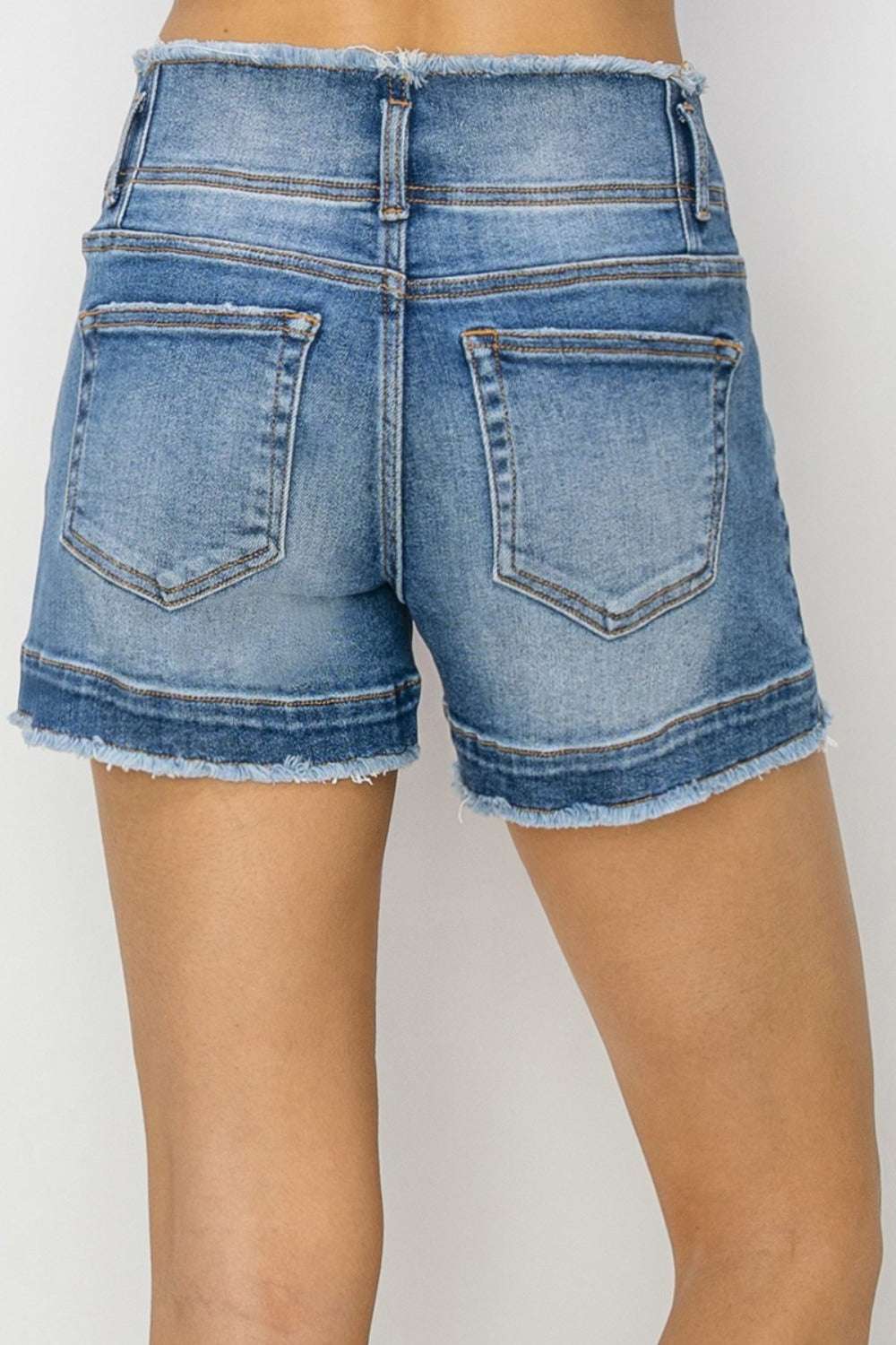 RISEN High Rise Seam Detailed Raw Edge Denim Shorts with back pockets and raw hem detailing.