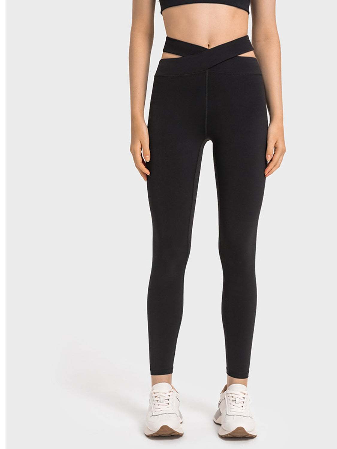 Millennia Crisscross Cutout Sports Leggings in black, stretchy nylon-spandex blend, stylish design.