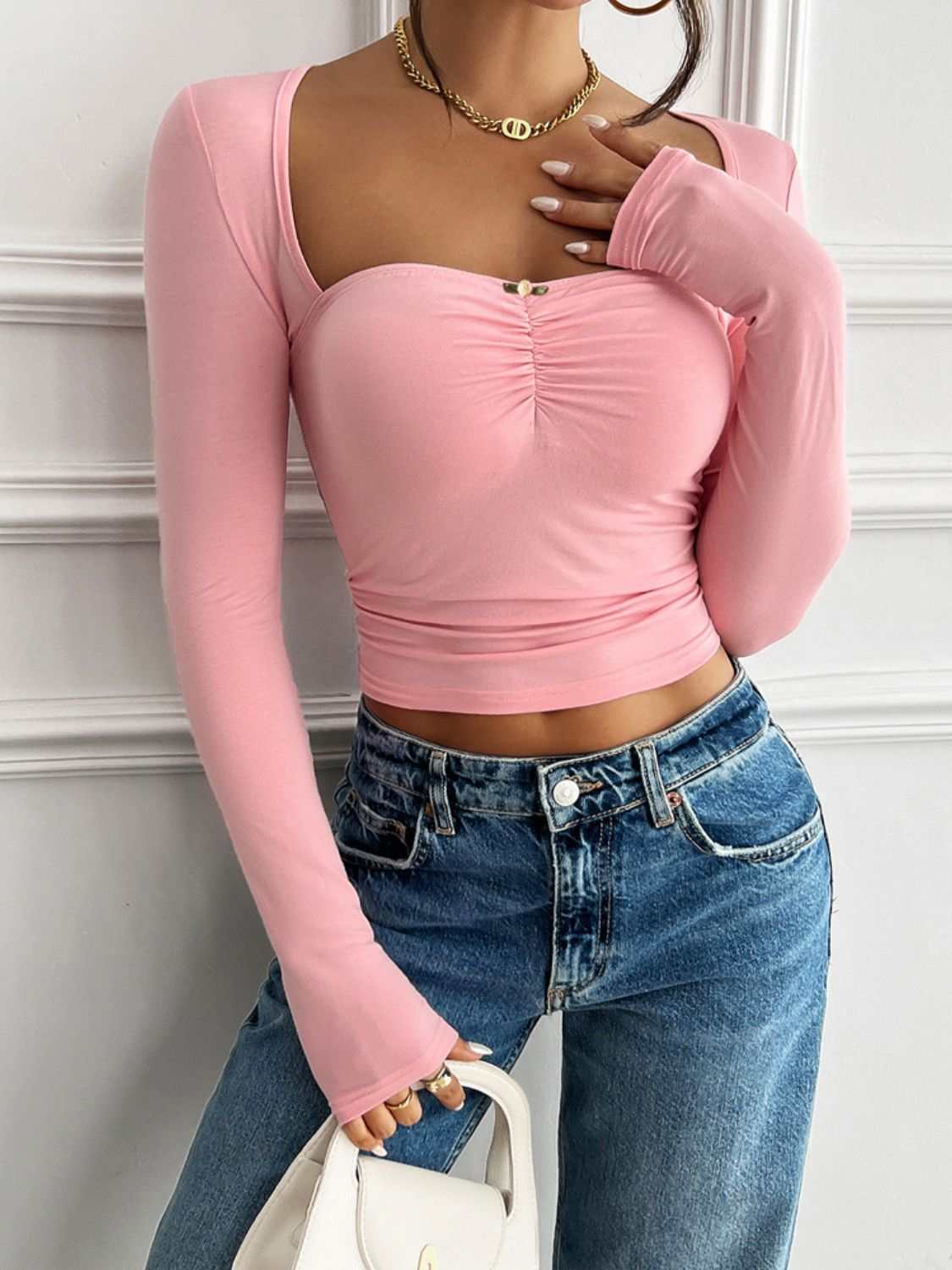 Devine Cutout Square Neck Long Sleeve T-Shirt in pink with a fitted design.