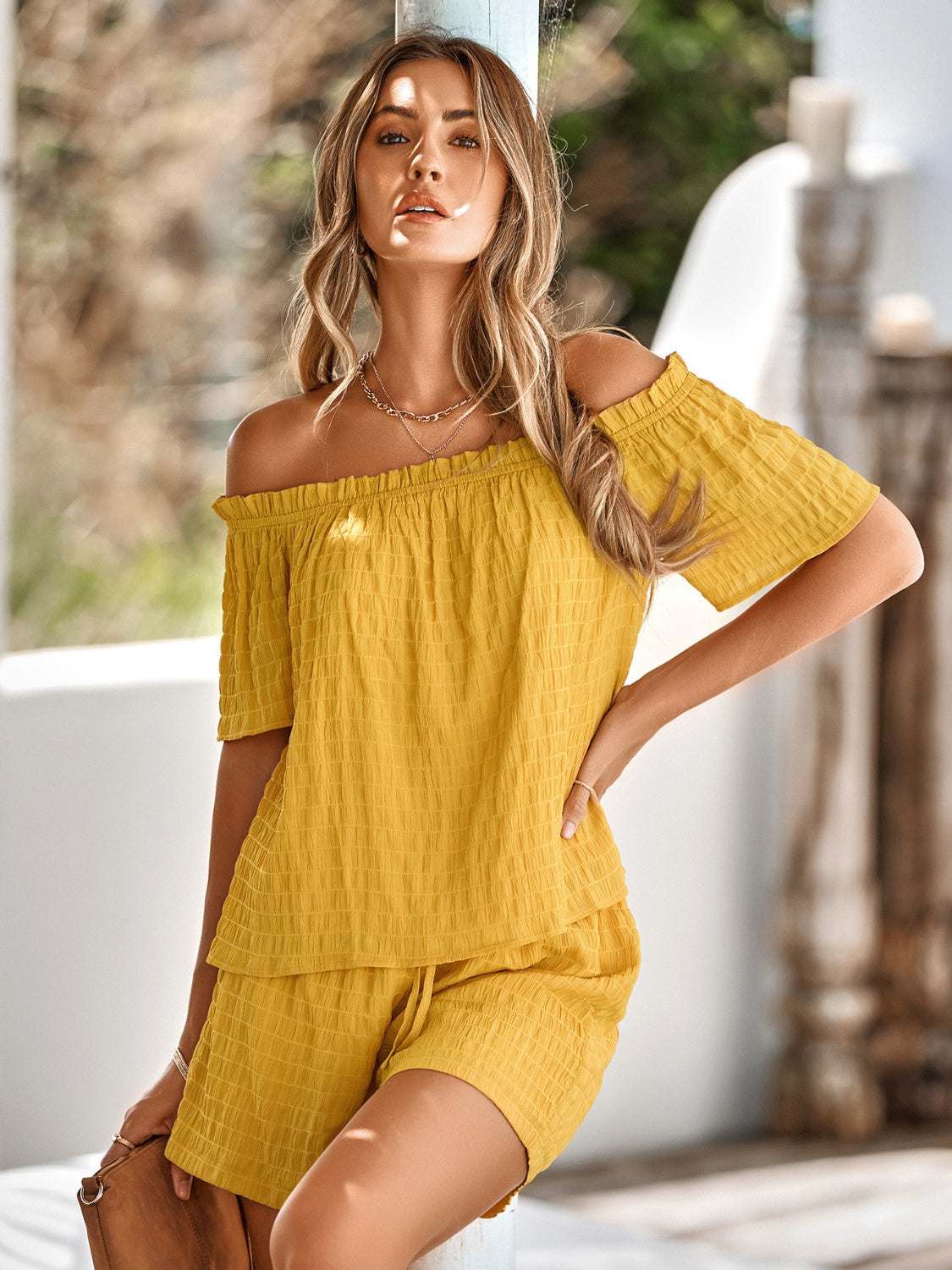 Full-size off-shoulder short sleeve top and tied shorts set in yellow.