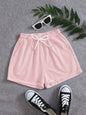 Pink drawstring pocketed elastic waist shorts made of polyester.