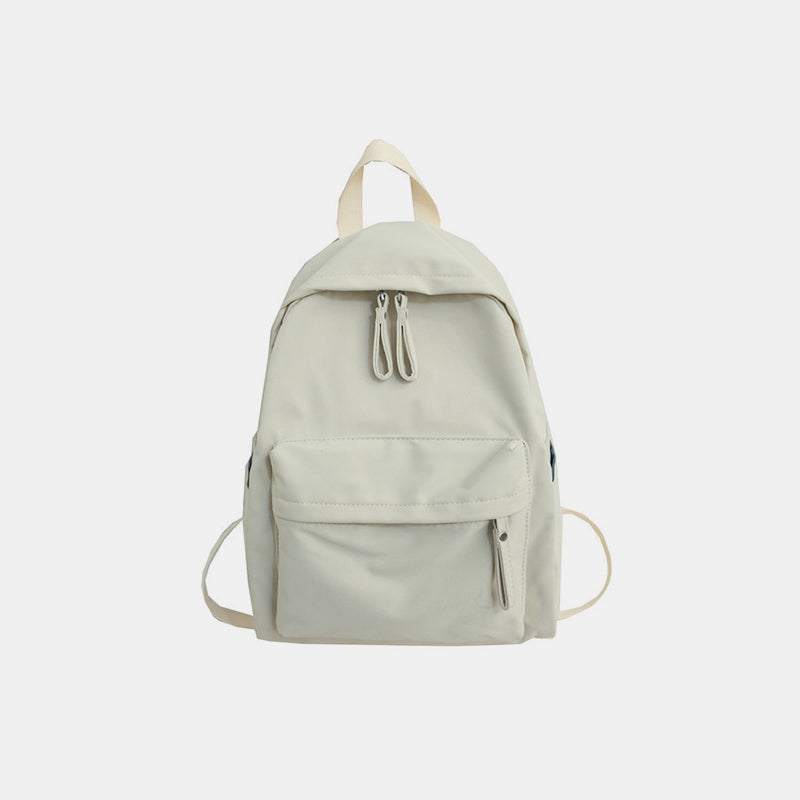 Large zip cotton backpack bag in beige with a front pocket.