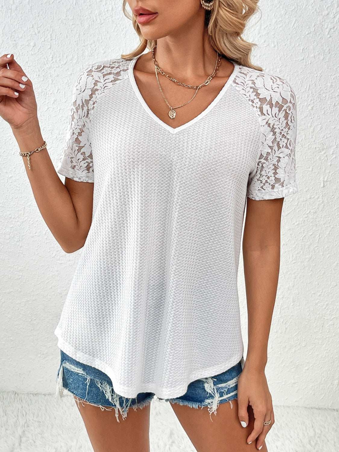 Ivy Lane white V-neck short sleeve T-shirt with lace detail.