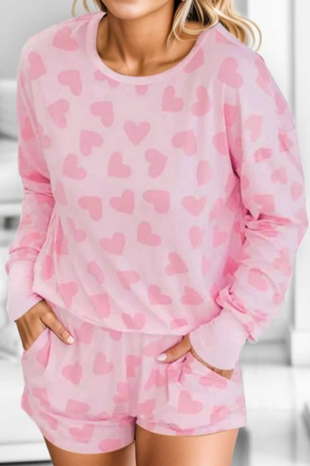 Heart Print Round Neck Top and Shorts Lounge Set in pink.