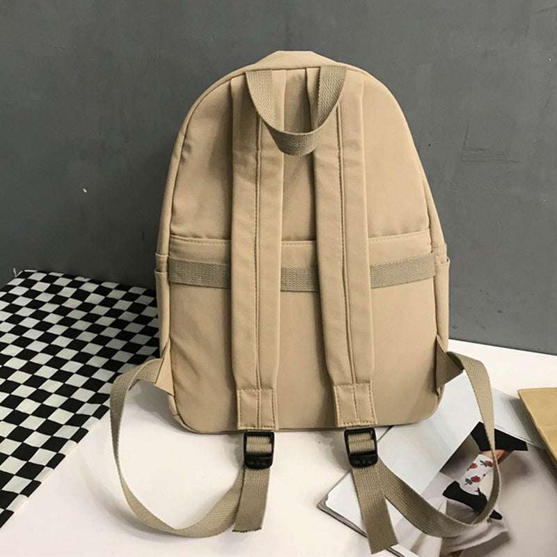 Large zip cotton backpack bag in beige, imported, with adjustable straps.