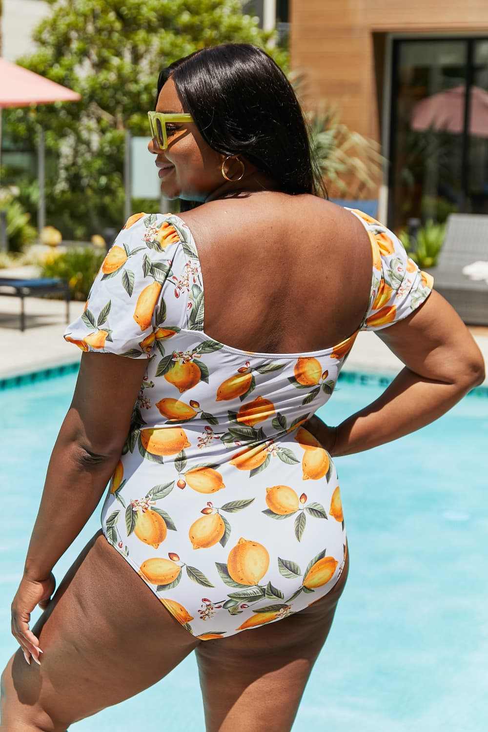 Cottage-core citrus orange one-piece swimsuit with puff sleeves by Marina West Swim.