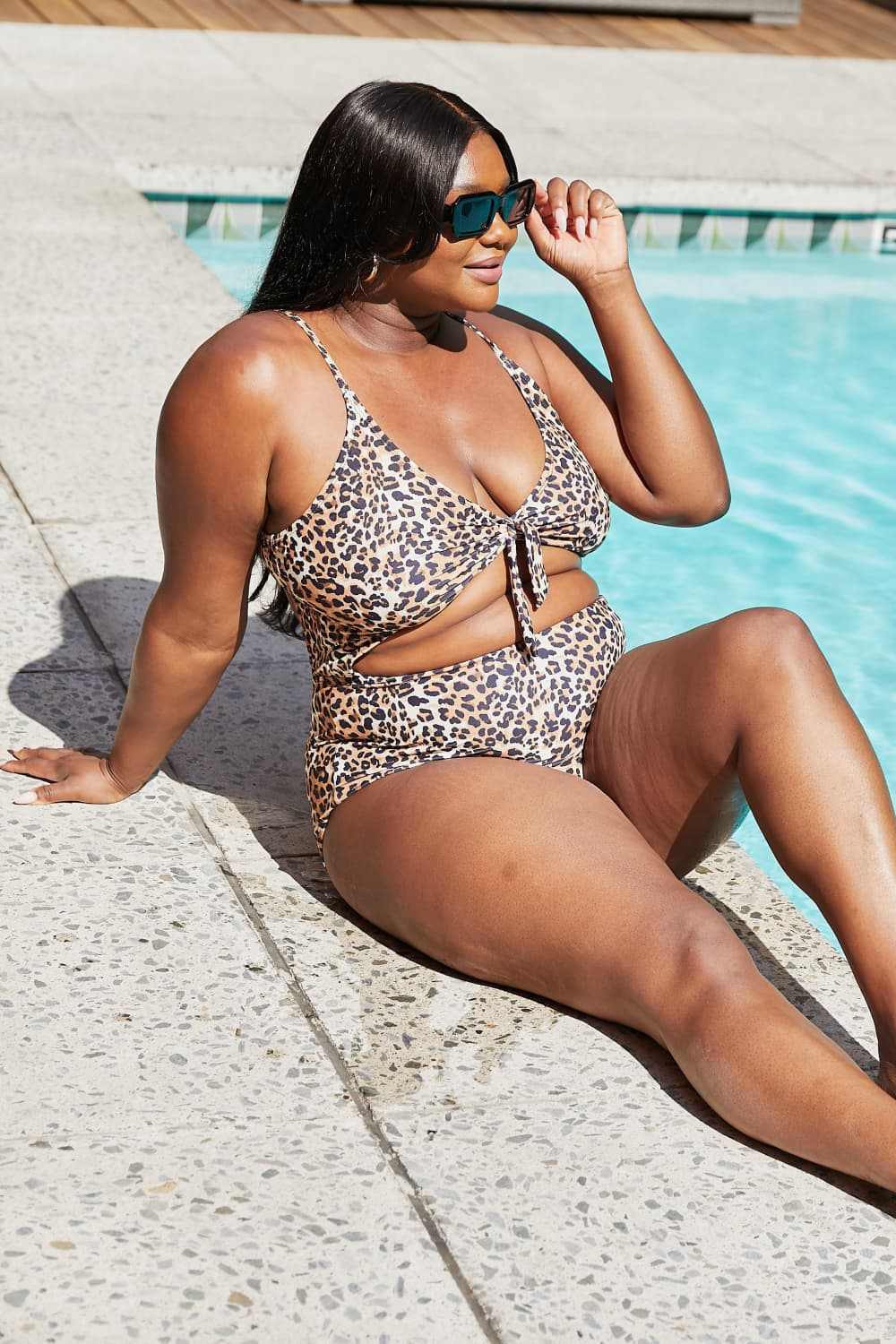 Leopard print cutout one-piece swimsuit with plunging neckline by Marina West Swim.