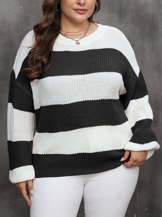 Plus size striped round neck long sleeve sweater in black and white.