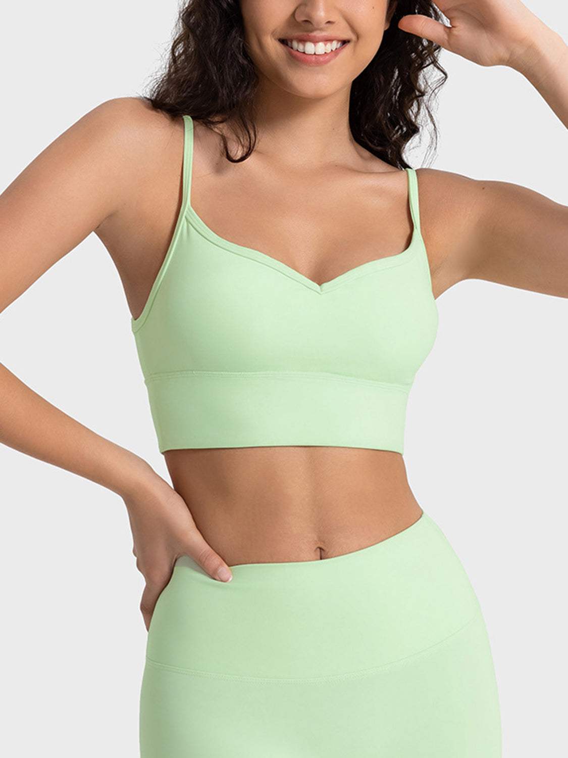 Millennia Spaghetti Strap Sport Bra in light green, stretchy and with removable padding.